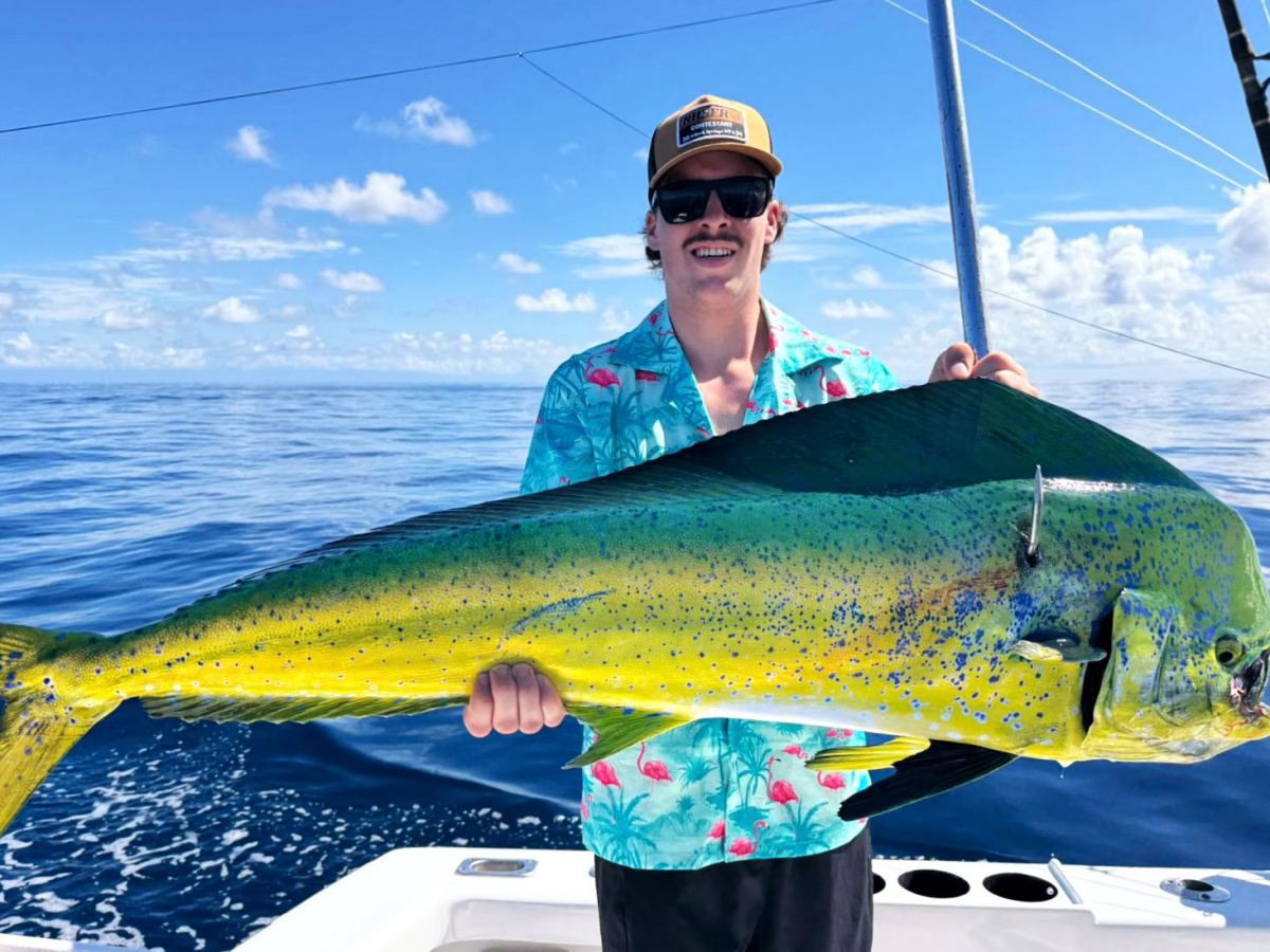Angler showing a colorful Dorado caught offshore in Costa Rica
